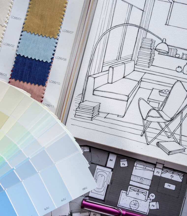 Fabric swatches and paint samples with architectural floor plan drawings